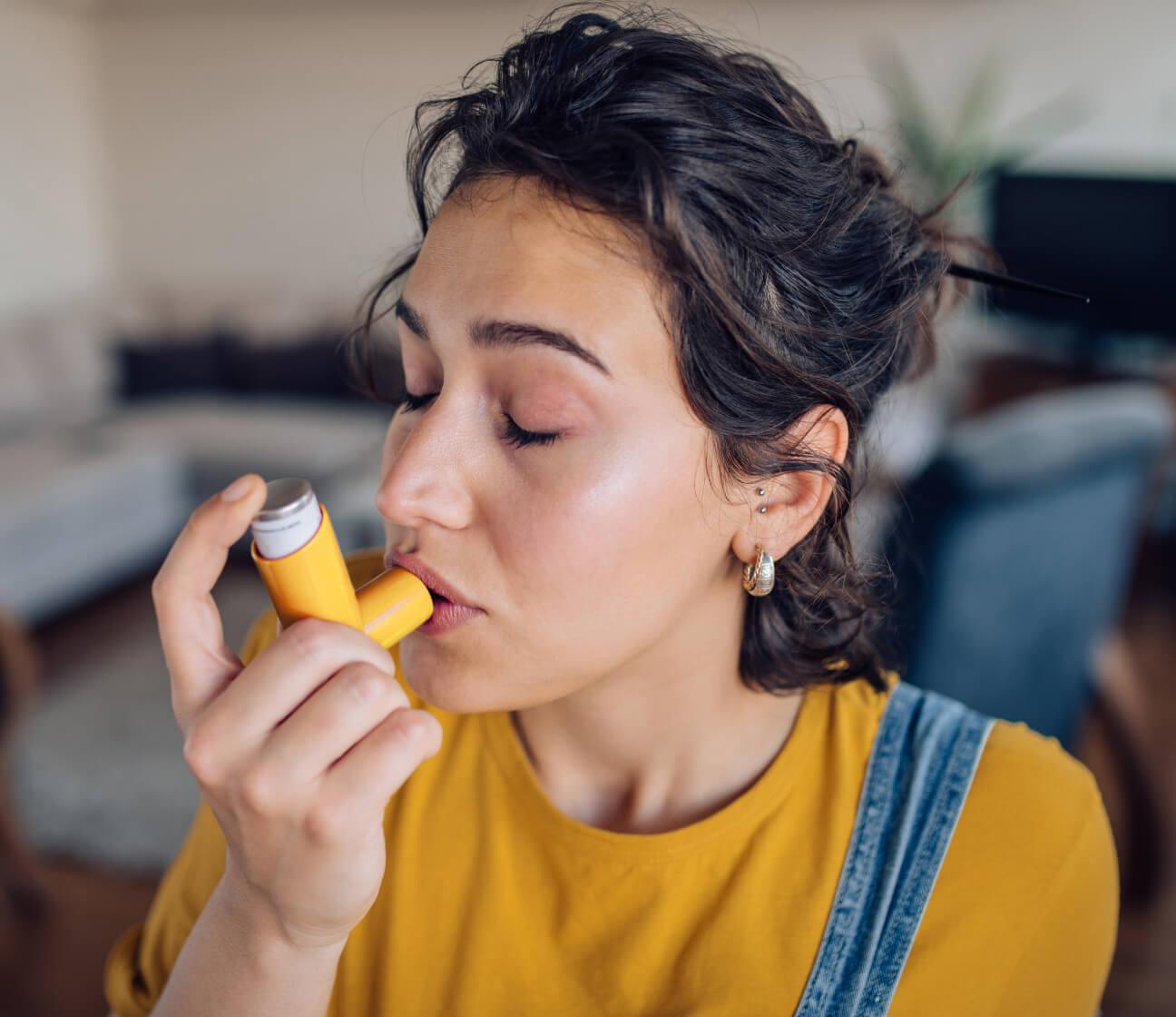 Woman using inhaler