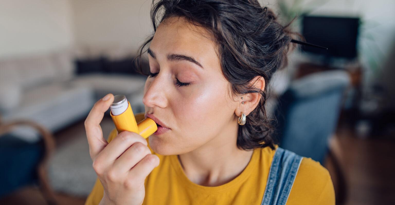 Woman using inhaler