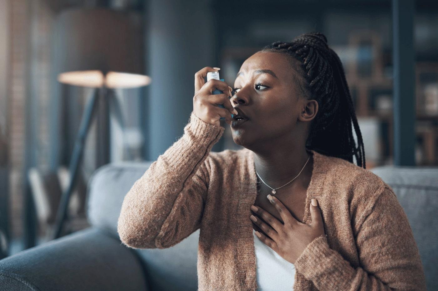 Woman using inhaler