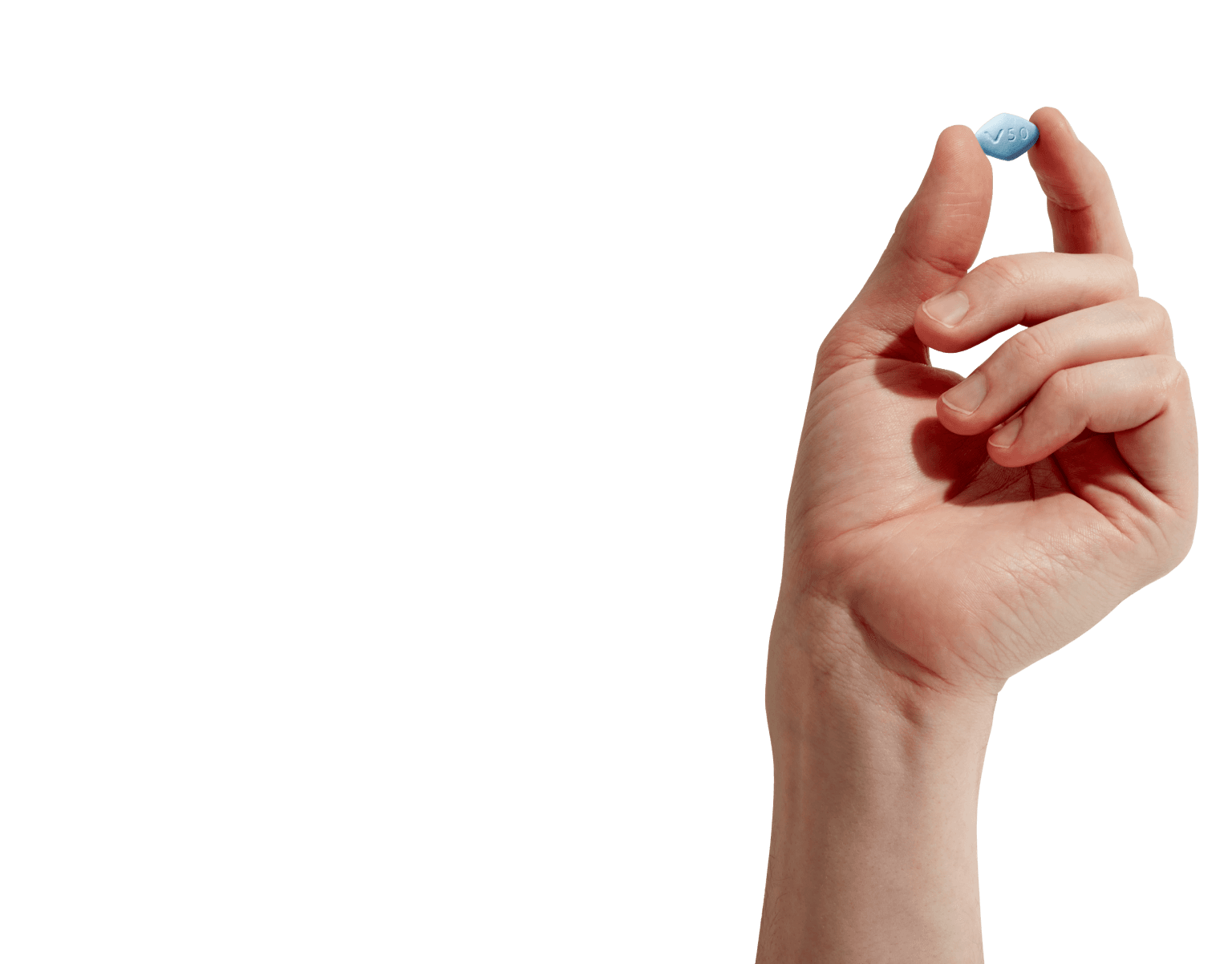 Hand holding a sildenafil pill